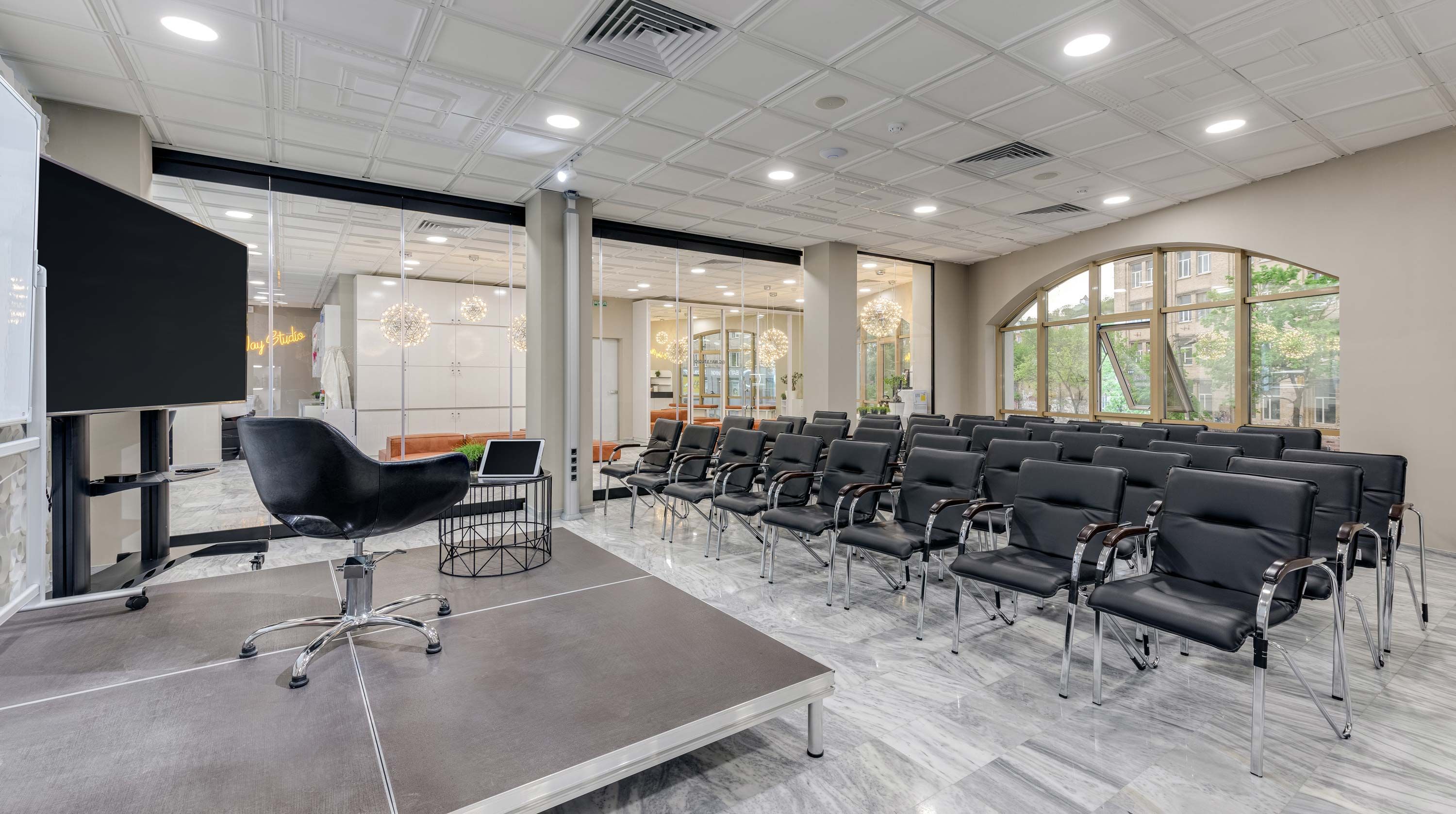 training spaces with black chairs and presentation technology