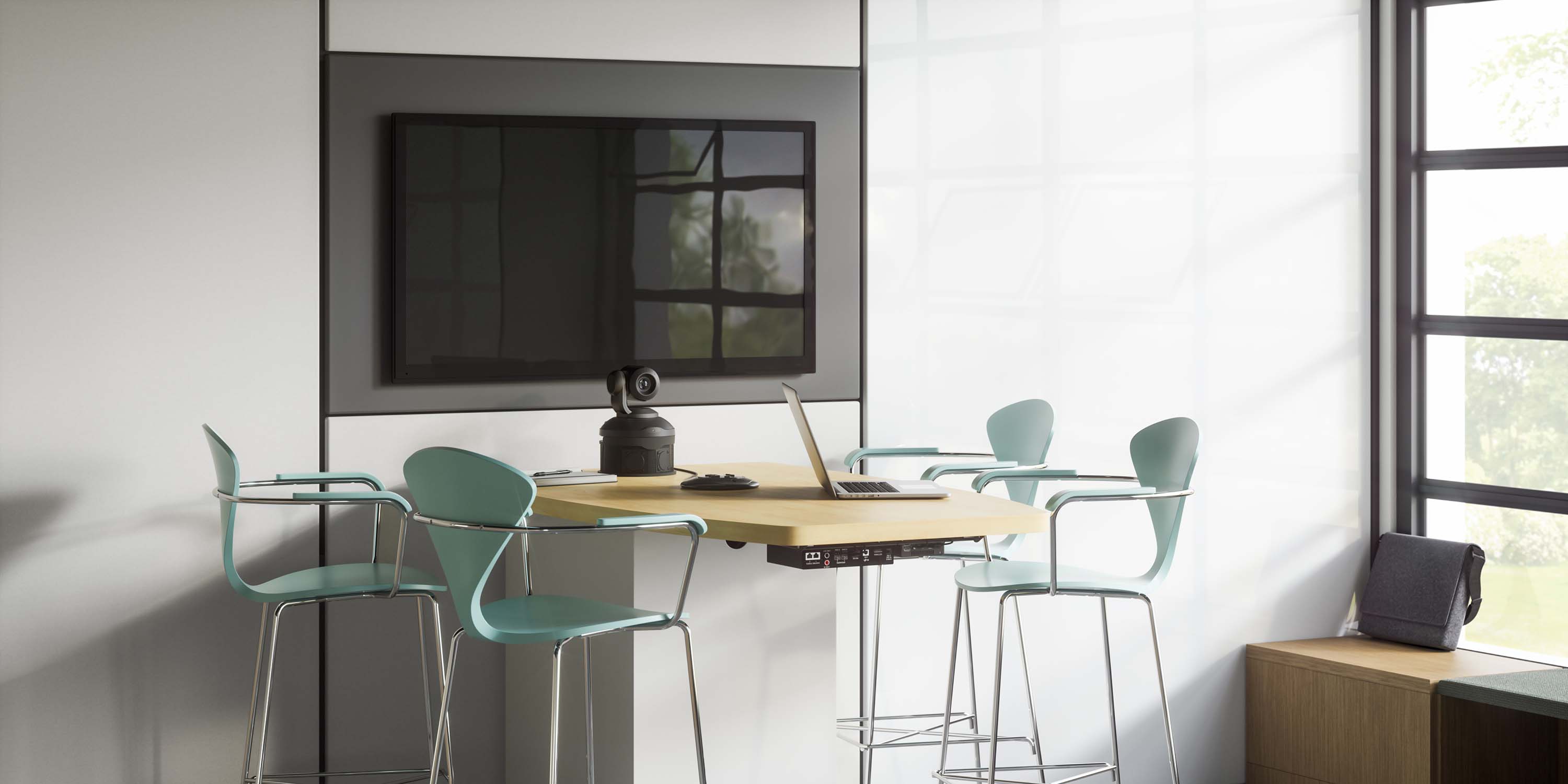 huddle room with wooden table and black chairs